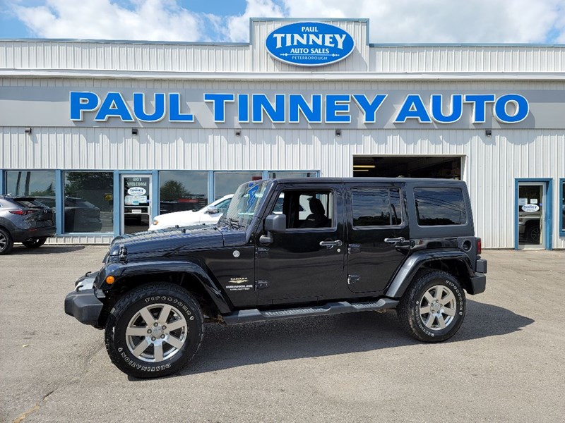 Photo of  2014 Jeep Wrangler Unlimited Sahara for sale at Paul Tinney Auto in Peterborough, ON