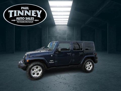 Photo of  2013 Jeep Wrangler Unlimited Sahara for sale at Paul Tinney Auto in Peterborough, ON