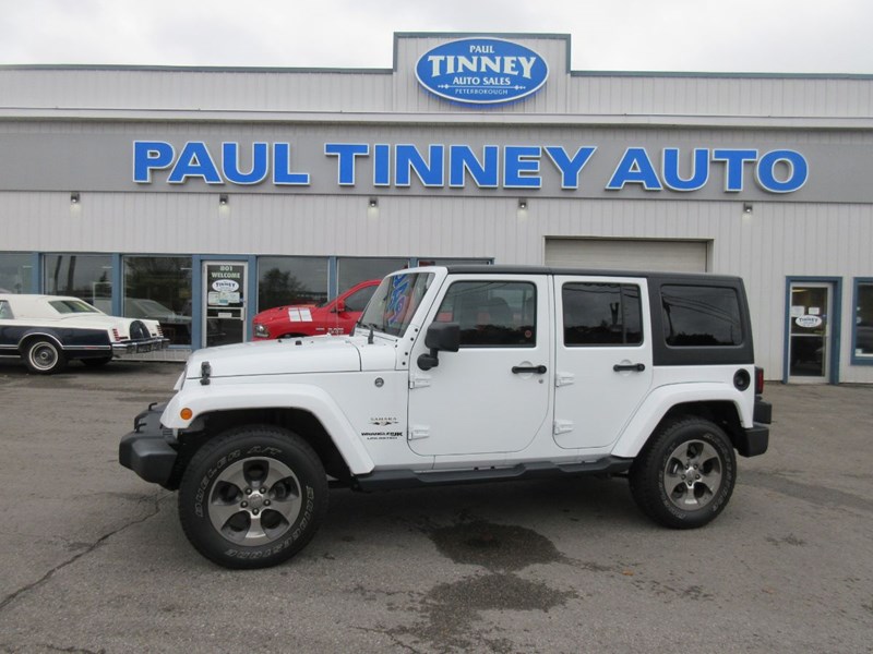Photo of  2018 Jeep Wrangler JK Unlimited Sahara for sale at Paul Tinney Auto in Peterborough, ON
