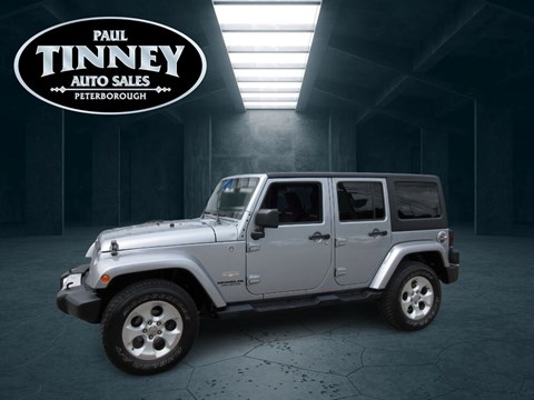 Photo of  2014 Jeep Wrangler Unlimited Sahara for sale at Paul Tinney Auto in Peterborough, ON