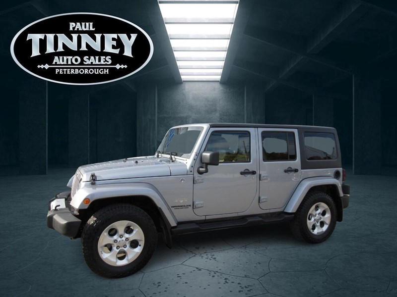 Photo of  2015 Jeep Wrangler Unlimited Sahara for sale at Paul Tinney Auto in Peterborough, ON