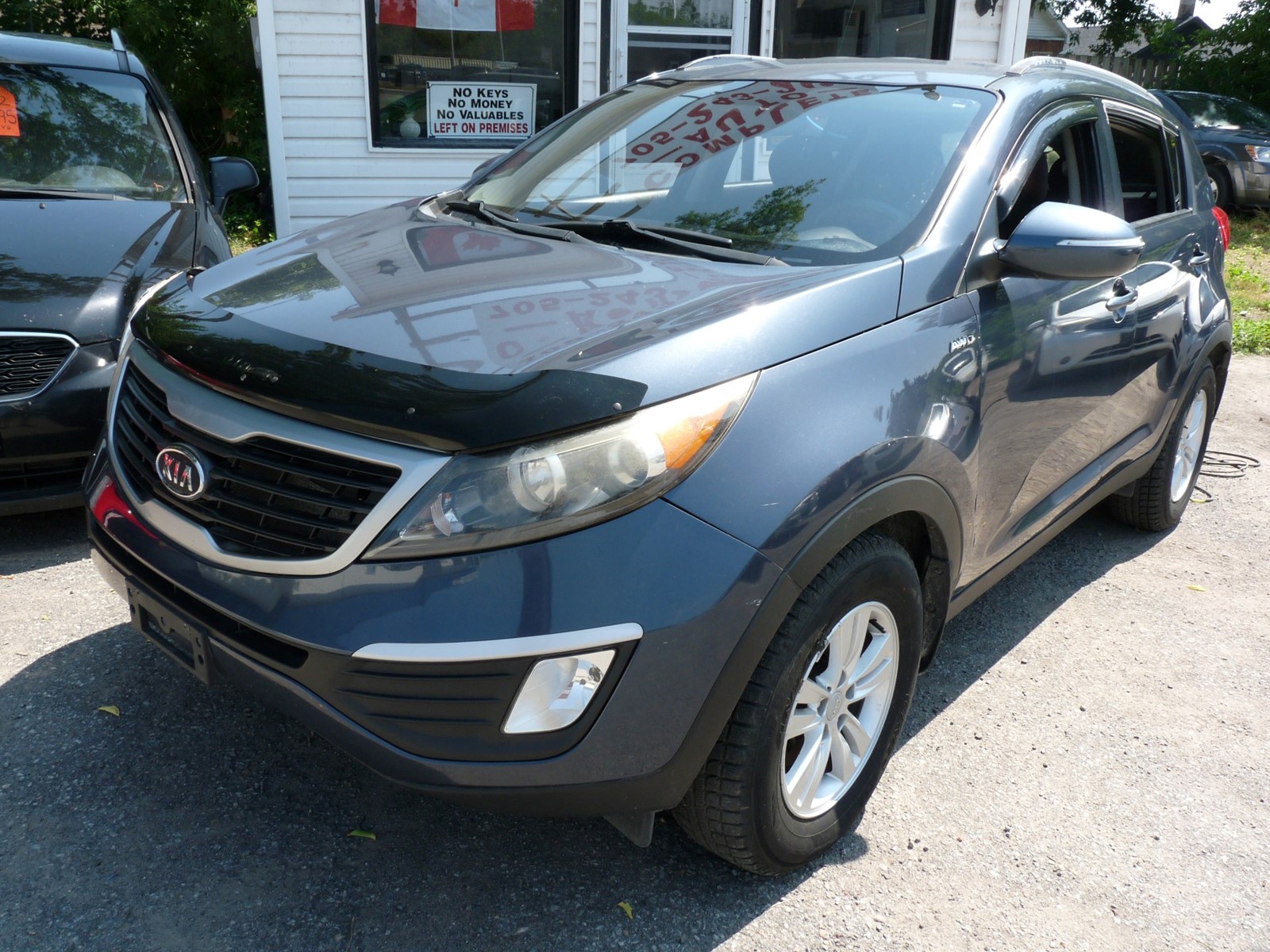 Photo of 2012 KIA Sportage LX AWD for sale at Complete Auto in Peterborough, ON