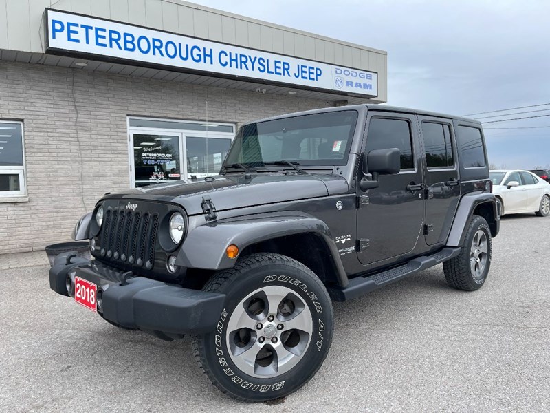 Photo of  2018 Jeep Wrangler JK Unlimited Sahara for sale at Peterborough Chrysler in Peterborough, ON