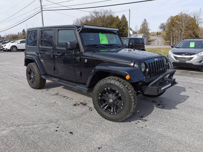 Photo of  2014 Jeep Wrangler Unlimited Sahara for sale at Patterson Auto Sales in Madoc, ON