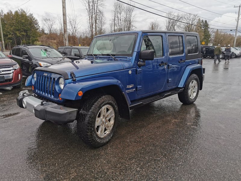 Photo of  2010 Jeep Wrangler Unlimited Sahara for sale at Patterson Auto Sales in Madoc, ON